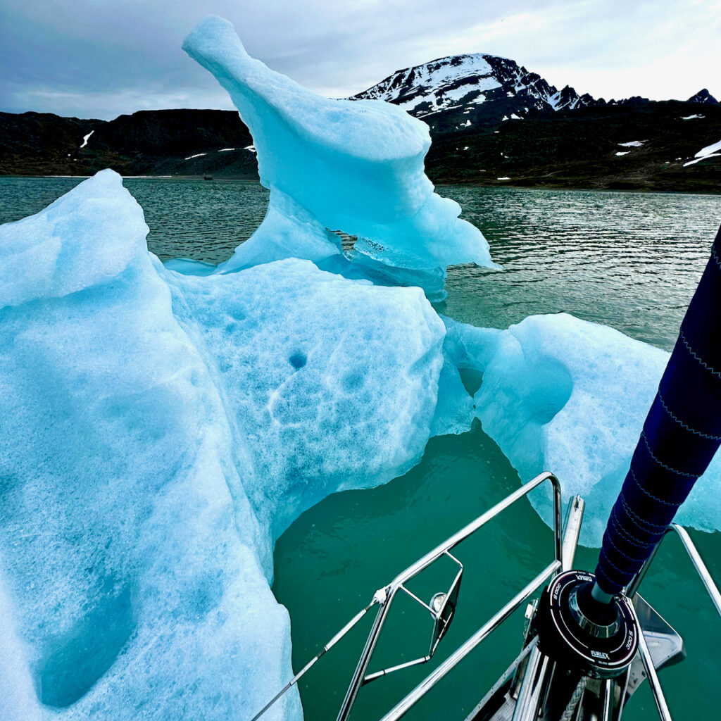 Sailing close to a glacier ice in the water