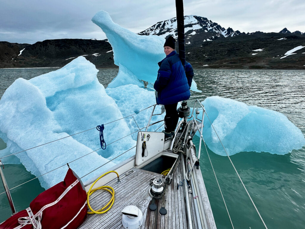 Sailing close to a glacier ice in the water