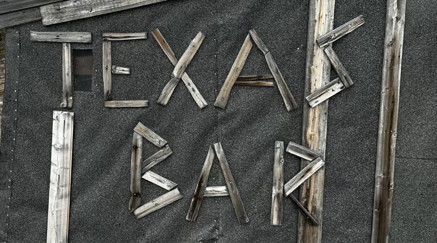 Picture of the texas bar sign at the cabin