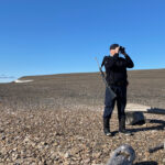 Steve scouting with binoculars