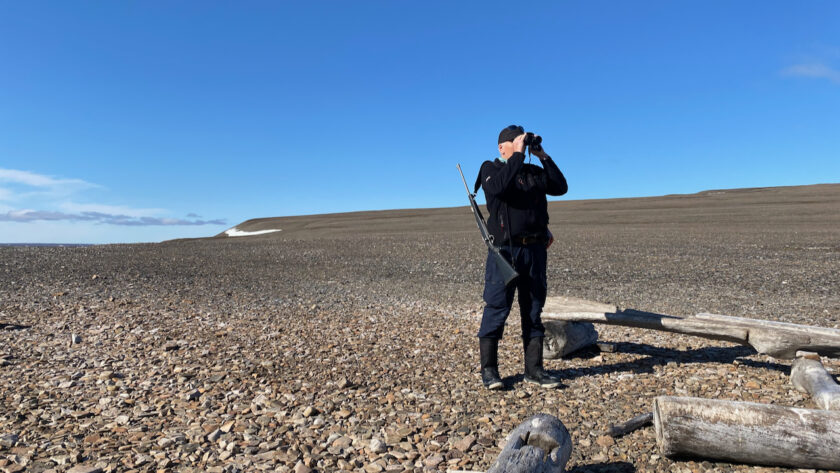 Steve scouting with binoculars
