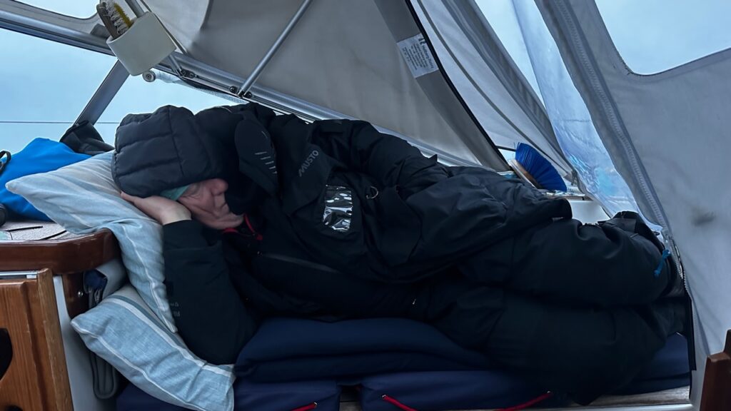 Picture of Steve sleeping in the cockpit